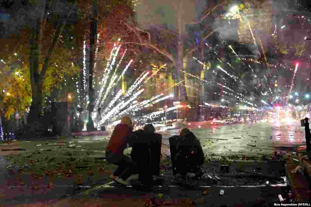 Protestors shoot fireworks toward police on December 4 amid protests along Tbilisi’s Rustaveli Avenue. The current unrest over the Georgian government’s decision to halt EU accession talks has centered around this thoroughfare in Tbilisi. It is the latest in a long list of political upheavals the street has endured. 