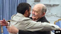 Iranian President Mahmud Ahmadinejad (left) welcomes the president of the UN General Assembly, Miguel d'Escoto Brockmann, in Tehran on March 9.