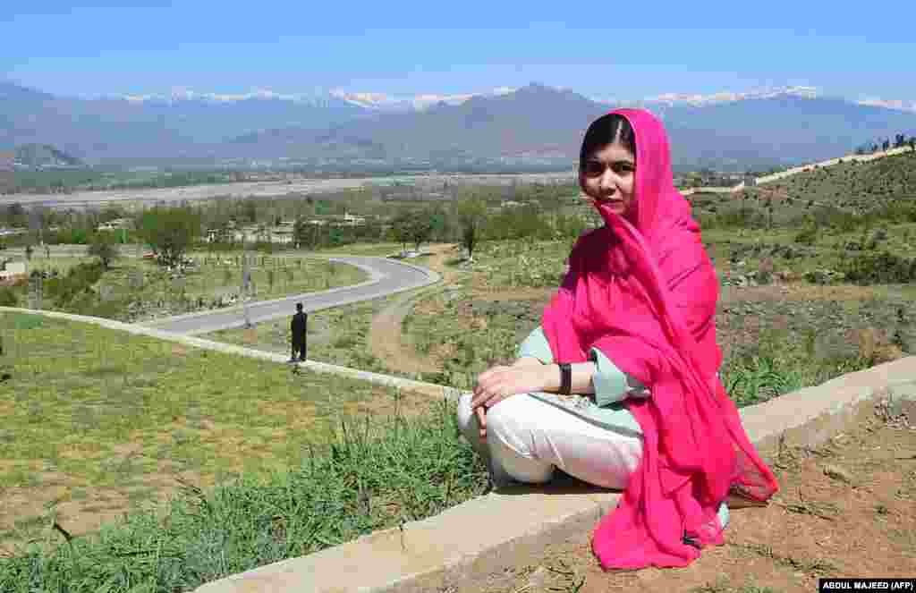 Yousafzai poses for a photograph on March 31, 2018, during her first visit home to Mingora in Pakistan's Swat Valley since being shot by Taliban militants.