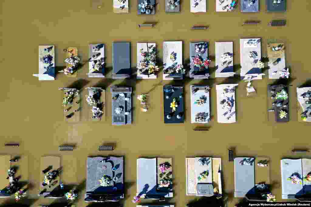 In southern Poland, a drone captured submerged graves in Brzeszcze on September 15. Prime Minister Donald Tusk confirmed one death due to the flooding in the southwestern region. 