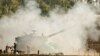 Israel - An Israeli 155mm artillery canon fires a shell from the Israel-Gaza Strip border into the Gaza Strip, 20Nov2012