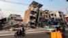 Commuters drive past a building that collapsed in the aftermath of the strong earthquake in Mandalay, Myanmar. 