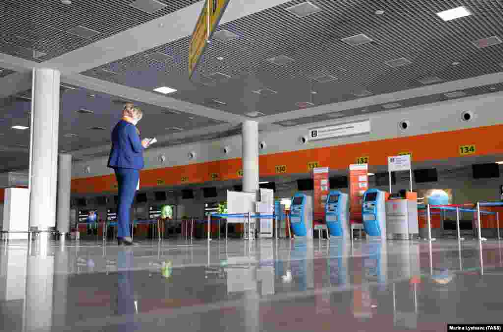 Deserted check-in desks in the empty departures hall at Moscow's Sheremetyevo International Airport on March 27