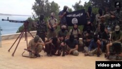 A screen shot of a video released in May purportedly showing Tajik militants fighting for Islamic State in Syria. There are reports that some 200 Tajiks are fighting for IS in the country. 