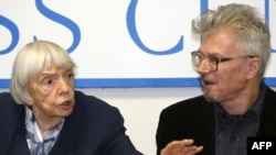 Activists Lyudmila Alekseyeva (left) and Eduard Limonov, at a press conference in Moscow in January, have split over Moscow officials' demands.