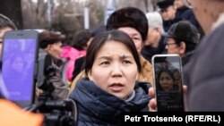 Inga Imanbai talks to reporters in Almaty on February 22.