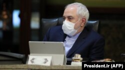 Iranian Foreign Minister Mohammad Javad Zarif wearing a protective mask during a cabinet meeting in Tehran. 