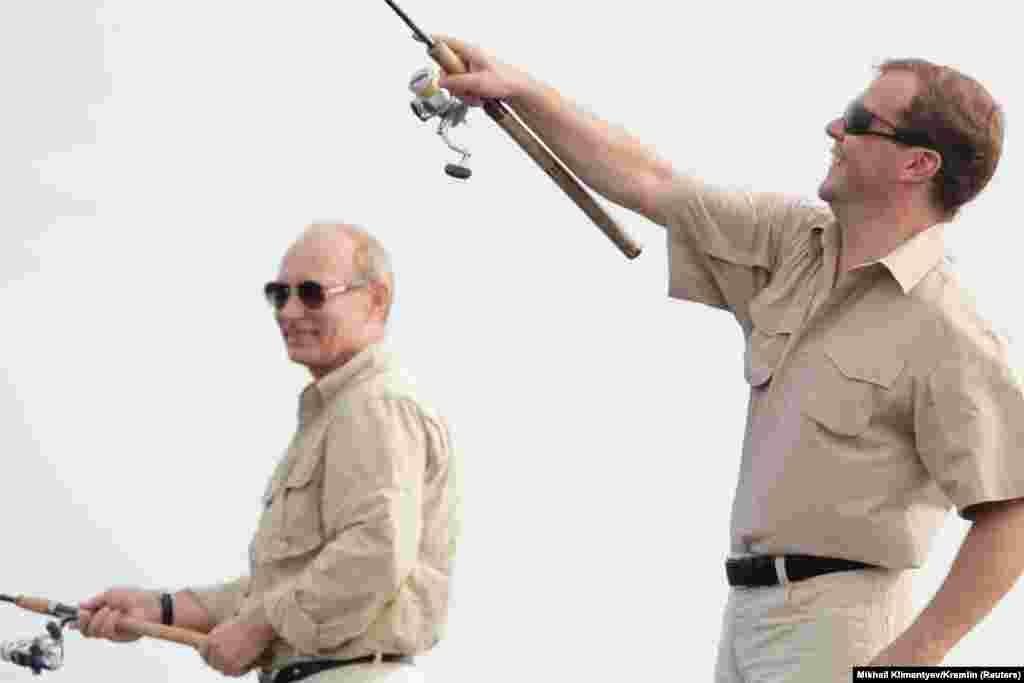 The two leaders take a fishing trip together on the Volga River in Russia's Astrakhan region on August 16, 2011. Ahead of the presidential election in 2012, Medvedev said he would step aside to allow Putin to become United Russia's candidate. Putin won the election and returned to the presidency on May 7, 2012, naming Medvedev as prime minister the same day. 