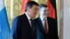 Germany's Merkel Urged To Tackle Rights Situation In Talks With Kyrgyz President