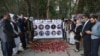 Mourners pray and light candles to pay tribute to Afghan journalists killed in a April 30 suicide attack in Kabul.