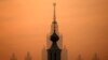 Russia -- A view shows the main building of the Lomonosov Moscow State University behind an Orthodox church, with the air temperature at about minus 17 degrees Celsius (1.4 degrees Fahrenheit), during sunset in Moscow, January 9, 2017
