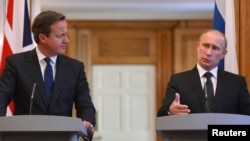 British Prime Minister David Cameron (left) and Russian President Vladimir Putin hold a joint news conference at 10 Downing Street, London, on June 16.