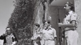 Iranian diplomat Reza Saffinia salutes Israeli soldiers as he enters the residence of Israel’s first president, Chaim Weizmann, near Tel Aviv in 1950.<br><br>In 1950, Iran broke with its Arab neighbors by informally recognizing the fledgling Jewish state.<br><br>