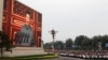 Chinese President Xi Jinping is seen on a giant screen as he delivers a speech marking the 100th anniversary of the Communist Party of China, on Tiananmen Square in Beijing on July 1.