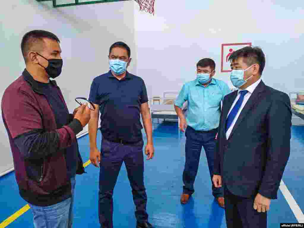 Government official Akylbek Osmonaliev (right) inspects makeshift hospitals in the Issyk-Kul region.