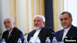 Iranian Foreign Minister Mohammad Javad Zarif (center), Iranian Atomic Energy Organization chief Ali Akbar Salehi (left), and Hossein Fereydoon, brother and close aide to President Hassan Rohani, in Vienna during a meeting with U.S. Secretary of State John Kerry.