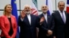 Austria -- Iranian Foreign Minister Mohammad Javad Zarif (2nd L) gestures next to EU foreign policy chief Federica Mogherini (L), Iranian ambassador to IAEA Ali Akbar Salehi (2nd R) and Russian Foreign Minister Sergei Lavrov (R) as they pose for a photo in Vienna, 14Jul2015.