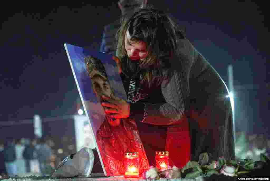 A woman mourns at the grave of a young soldier during a candlelight vigil in Armenia’s Yerablur cemetery on the eve of the anniversary. A reported 4,025 ethnic Armenian fighters were killed in the conflict, along with 88 civilians. Amnesty International accused both sides of war crimes, including gruesome executions. 