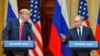 Then-President Donald Trump (left) listens as Russian President Vladimir Putin speaks at a joint press conference after a meeting in Helsinki in July 2018.