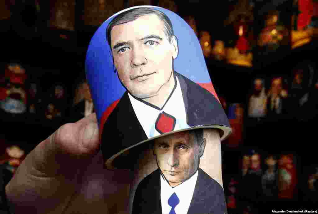 A matryoshka or Russian nesting doll at a market in St. Petersburg shows Putin lurking behind Medvedev. 