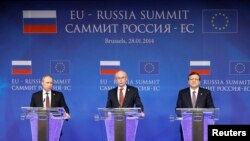 Russian President Vladimir Putin (left to right), European Council President Herman Van Rompuy, and European Commission President Jose Manuel Barroso address a joint news conference in Brussels on January 28.