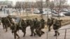 Отряд вооруженных военнослужащих в зимней экипировке. Актау, 21 декабря 2011 года.
