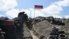ARMENIA -- Armenian soldiers walk in a trench at an Armenian-Azerbaijani border section near the village of Sotk in Gegharkunik province, June 18, 2021