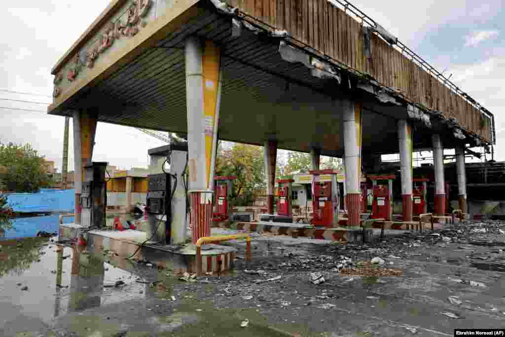 A heavily damaged gas station in Tehran. There have been unconfirmed reports that as many as 200 people were killed in the demonstrations nationwide. Amnesty International, citing eyewitness accounts, reported security personnel shooting into crowds from rooftops and "in one case, a helicopter."