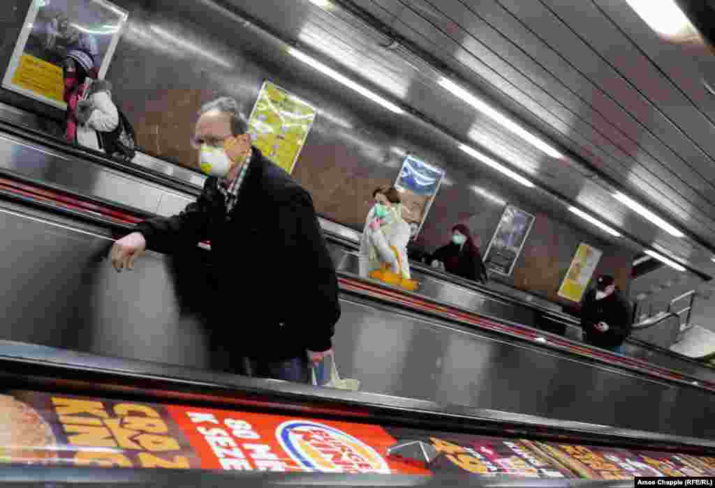 Commuters wearing masks ascend an escalator on March 17. 
