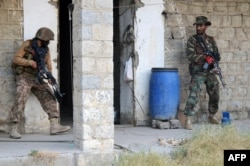 Pakistani soldiers taking position as they search a house during a military operation against Taliban militants in North Waziristan. (file photo)