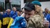 Former Ukrainian prisoners of war (POW) arrive after a prisoner swap with Russia, amid Russia's attack on Ukraine, in an undisclosed location in Ukraine, May 6, 2025.