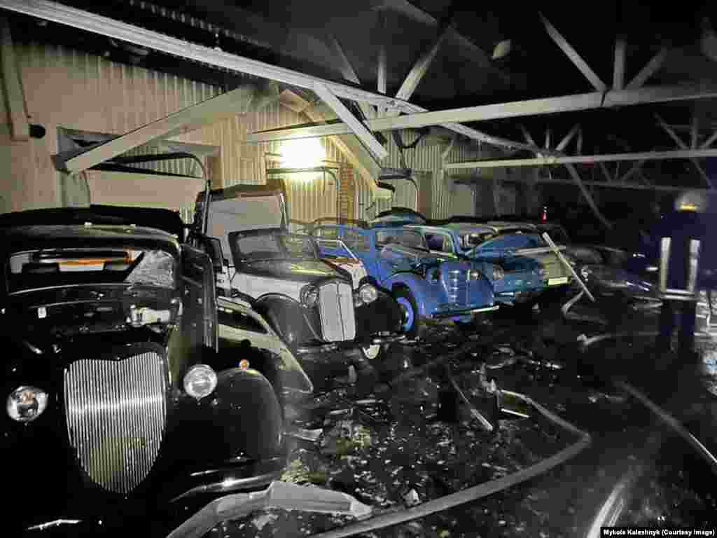 Damaged vintage cars are seen at the erstwhile residence of former Ukrainian President Viktor Yanukovych in photos released by the Kyiv Regional Military Administration on January 28 following a Russian drone strike. 