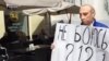 Interview: Putin-Mask Protester 'Safe' In Ukraine After Midnight Run From Russia