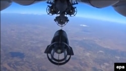 Bombs are dropped by a Russian warplane during an air strike near Idlib on October 5.