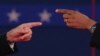 U.S. -- President Barack Obama and Republican presidential candidate Mitt Romney (L) gesture during a town hall style debate at Hofstra University in Hempstead, New York, 16Oct2012