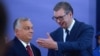 Hungarian Prime Minister Viktor Orban (left) recieves a state medal from Serbian President Aleksandar Vucic in Belgrade in September 2022.
