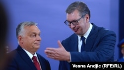 Hungarian Prime Minister Viktor Orban (left) recieves a state medal from Serbian President Aleksandar Vucic in Belgrade in September 2022.