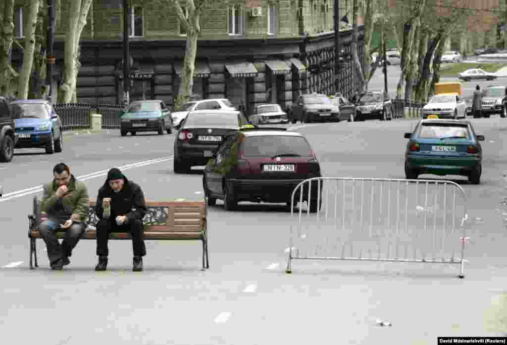 Demonstrators man a makeshift roadblock on Rustaveli Avenue during anti-government protests in 2009. In 2008, Georgian writer Guram Odisharia predicted that, "without a harmonic relationship between the authorities and society, the people’s hopes will always be deceived and the main player in our country’s political history will be Rustaveli Avenue, and not Georgian politicians.” 