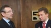 EU Energy Commissioner Andris Piebalgs (left) with Gazprom's Aleksei Miller in Brussels on January 8