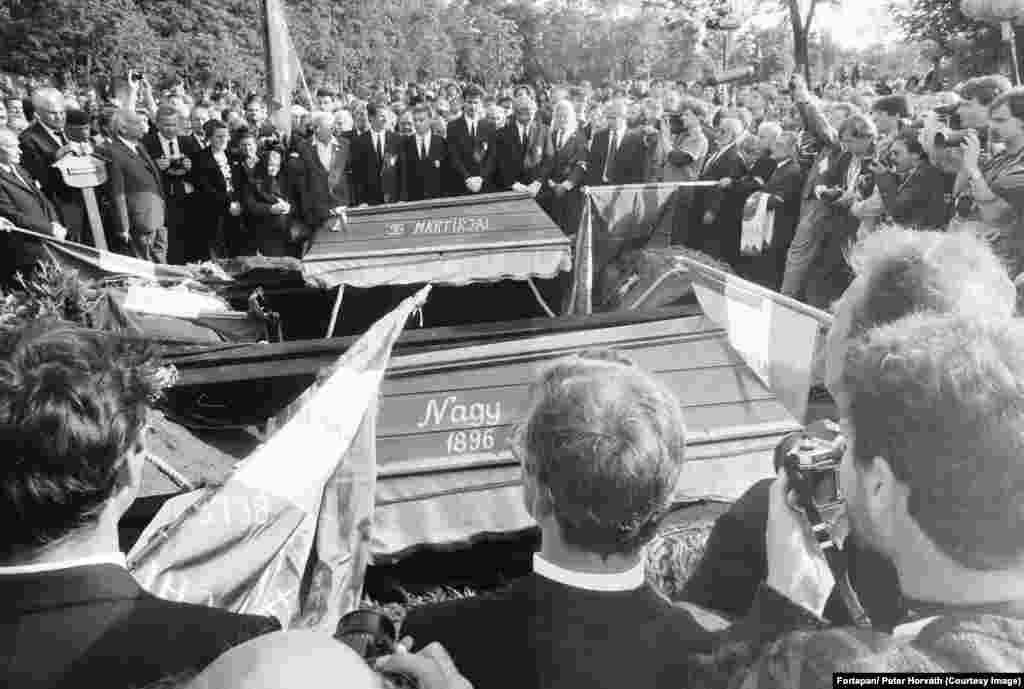 Mourners surround the coffin of Imre Nagy and another victim of the Soviet crackdown on Hungary's 1956 revolutionaries. In June, tens of of thousands of people gathered as Imre Nagy, the former communist prime minister of Hungary was reburied with full honors. Nagy had sided with the revolutionaries in Hungary’s 1956 anti-communist uprising. 