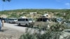 A convoy moves under police escort in Kurram district earlier this month. 