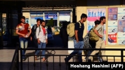 A file photo from August 2018 shows Afghan returnees from Iran arriving in Herat Province. 