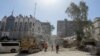 Rescue workers search the rubble of a building annexed to the Iranian Embassy a day after an air strike in Damascus on April 2.