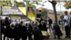 Protesters take part in a demonstration near the Uzbek Embassy in Berlin organized by Amnesty International against torture in Uzbek prisons in 2014.
