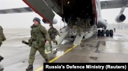 Russian soldiers disembark from a military aircraft as part of the CSTO mission at an airfield in Kazakhstan on January 7.