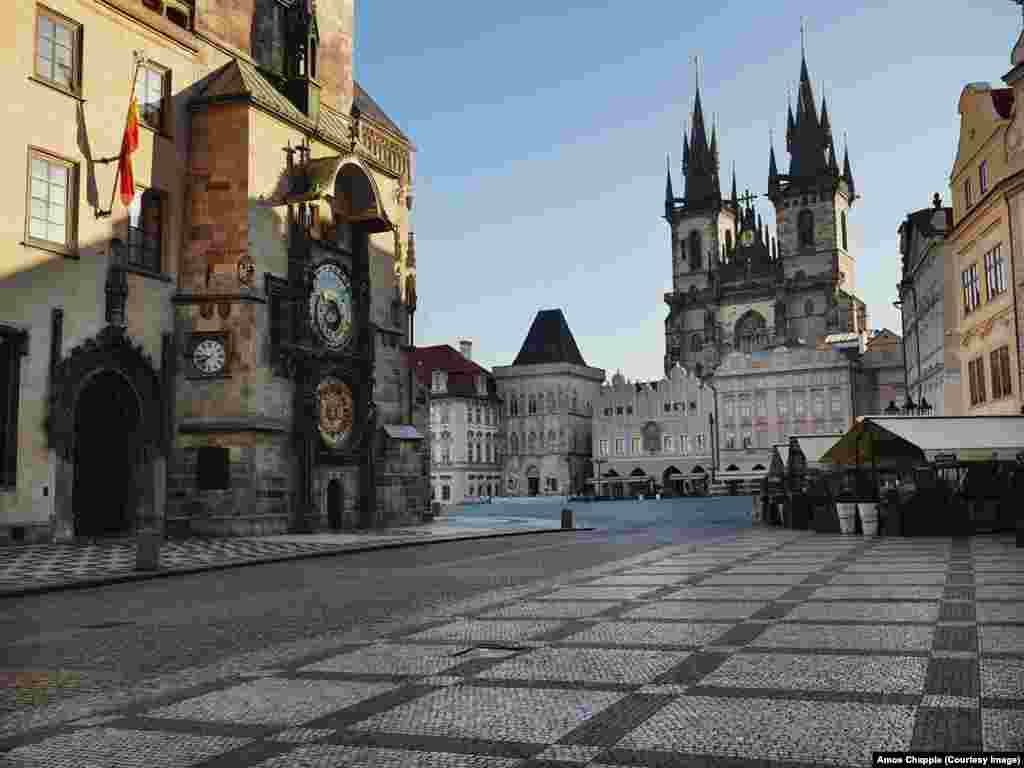 One of Prague's most famous sites, Old Town Square, stands nearly empty. This space is usually thronged with thousands of tourists. 