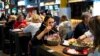 Despite the coronavirus, places like the Depo Food Mall in Moscow remain packed with customers. Experts point to a widespread distrust in official guidance as one factor for such behavior.