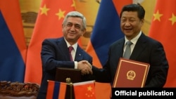 China - President Xi Jinping and his visiting Armenian counterpart Serzh Sarkisian adopt a joint declaration after talks in Beijing, 25Mar2015.