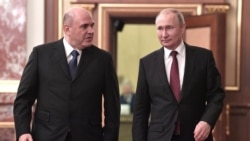 Russian Prime Minister Mikhail Mishustin (left) and President Vladimir Putin arrive for a cabinet meeting last month.