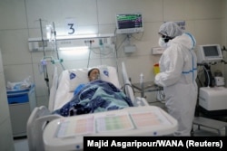 A patient being treated for coronavirus at a hospital in Tehran.